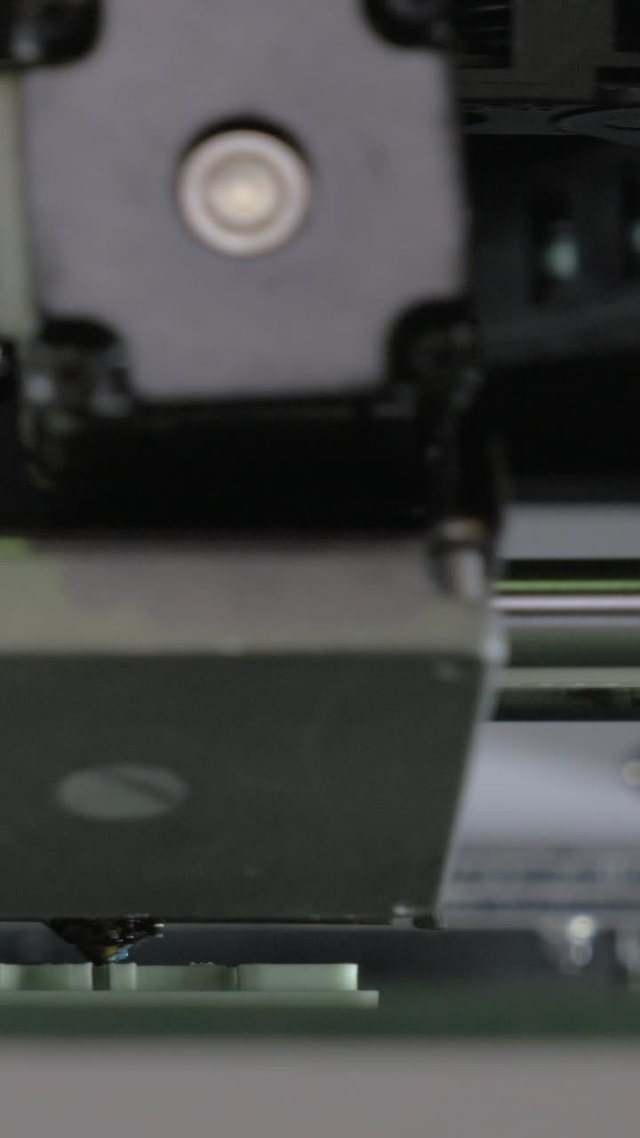 Close Up of 3D Printer Nozzle Extruding Plastic Material