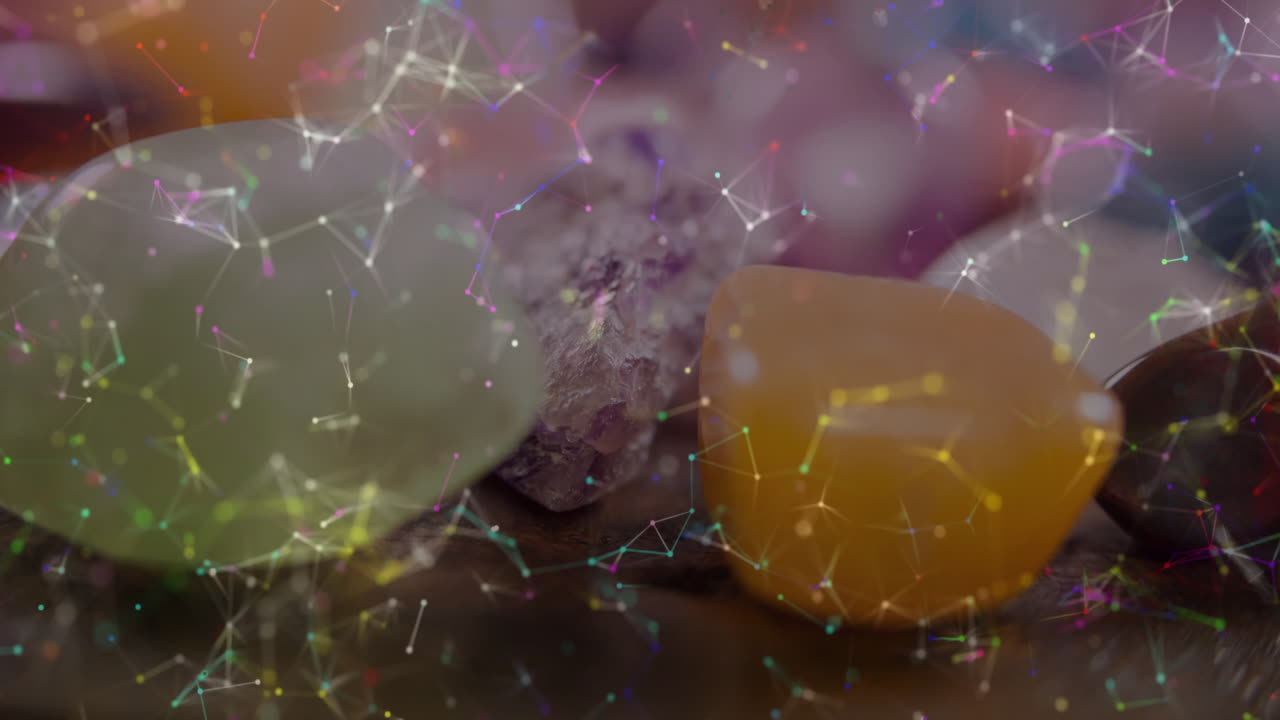 Translucent green, bright orange and purple stones floating within glowing digital network overlay