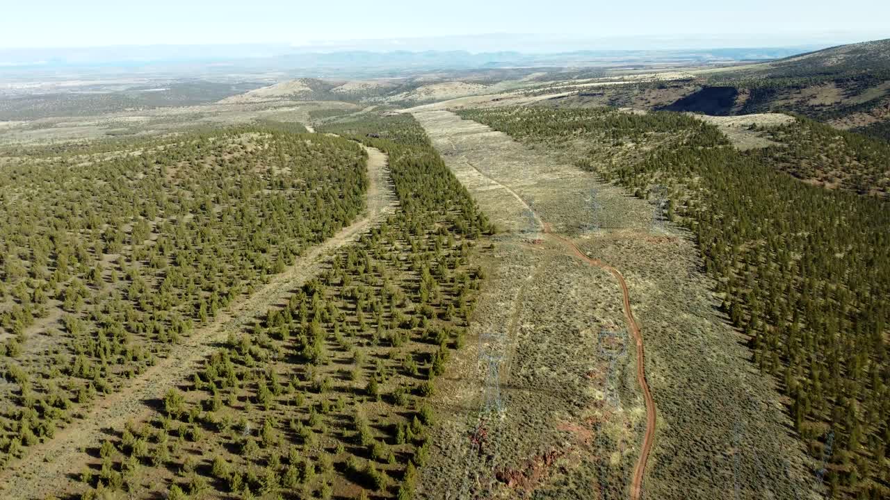 US, Oregon, Madras, , 2025-04-09 - Drone view of three high power transmission lines through the desert in central Oregon in spring