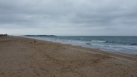 Sea-Beach-Filmic-Scene-in-Tarifa-in-Spain-with-Cloudy-Sky-by-Drone-in-4K