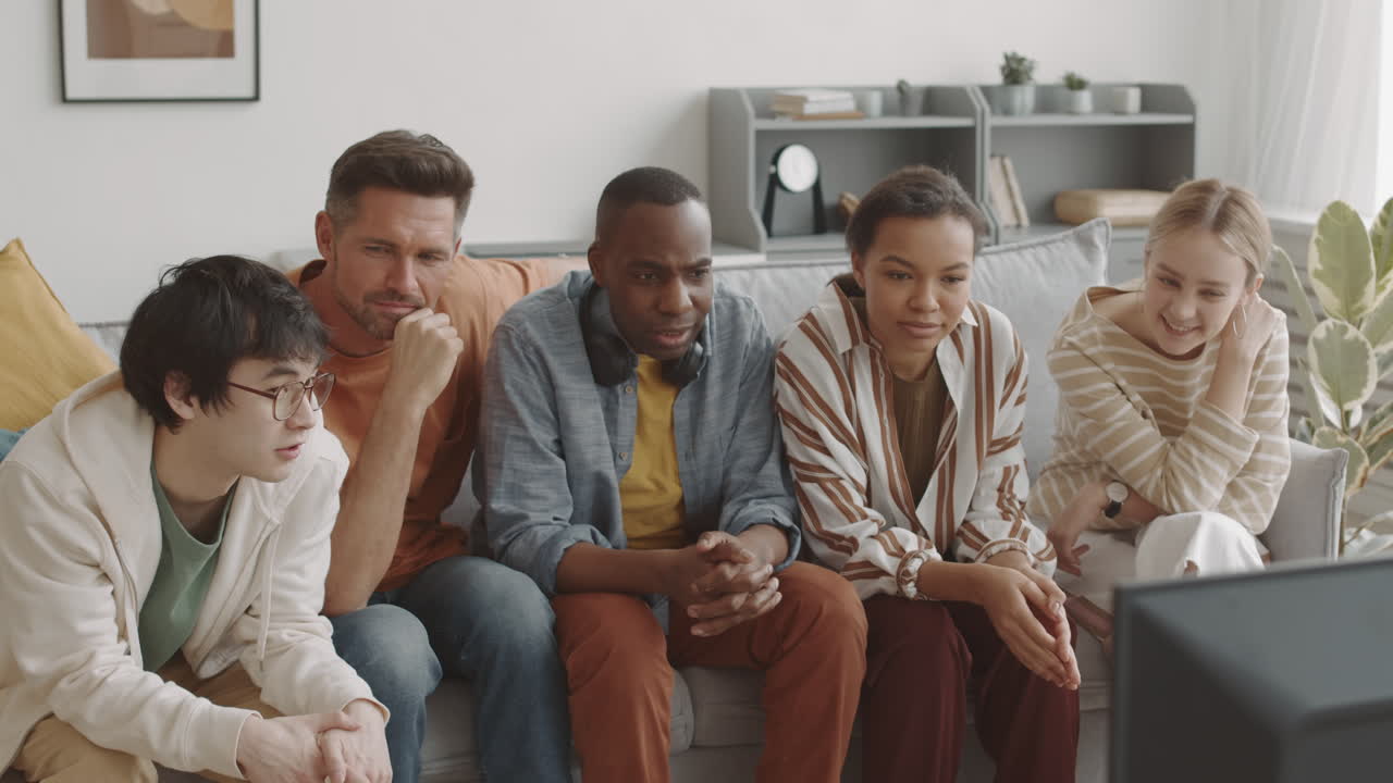 Multiethnic Men and Women Watching TV