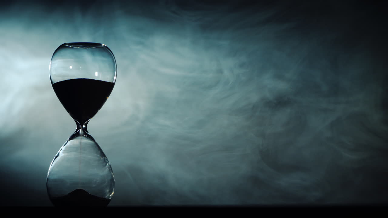 Hourglass amid swirling fog