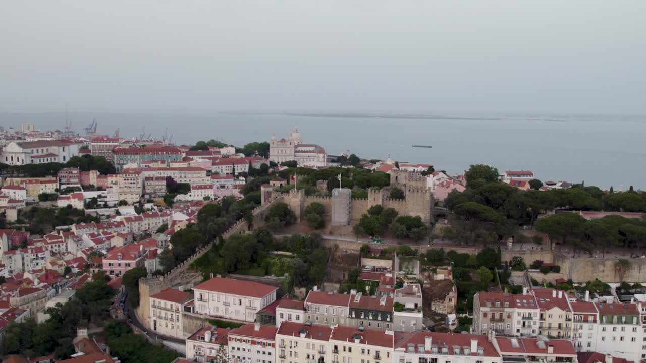 A 4K drone shot of Saint George's Castle, a 11th-century hilltop Moorish Royal Castle and museum in Lisbon, Portugal