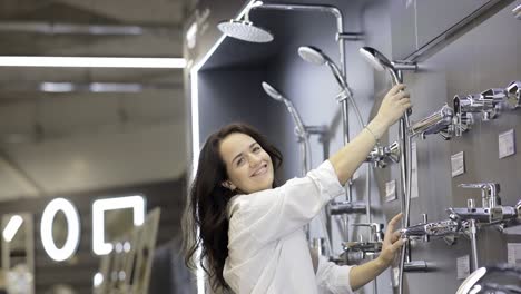 woman shopping for bathroom fixtures in a store