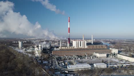 aerial drone sky landscape of thermal power station smoking white fumes, factory