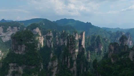 panoramic drone shot in front of tall pillars of zhangjiajie natural forest park