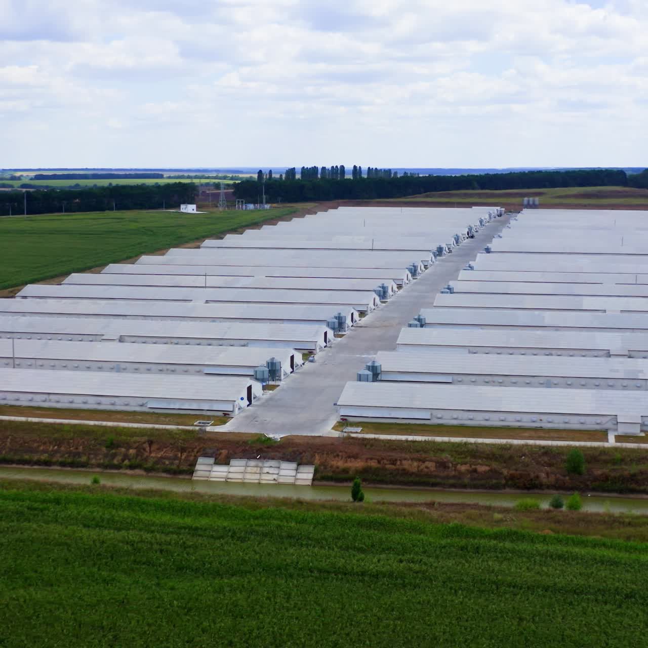 Aerial view of industrial chicken house. Modern farm poultry buildings. Agriculture