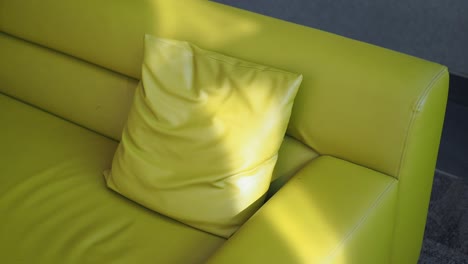 lime green sofa with pillow