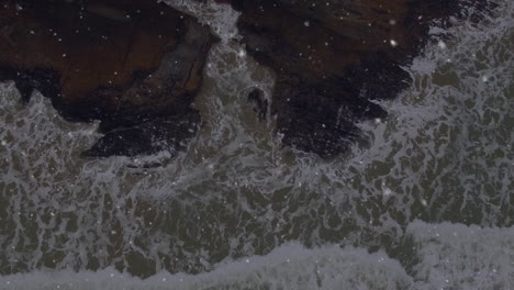 animation of falling dots over seascape