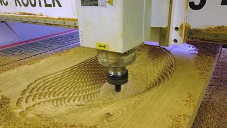 cnc router machine milling out big hole out of oak wooden board for wooden sink