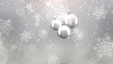 silver balls with fly snowflakes and glitters