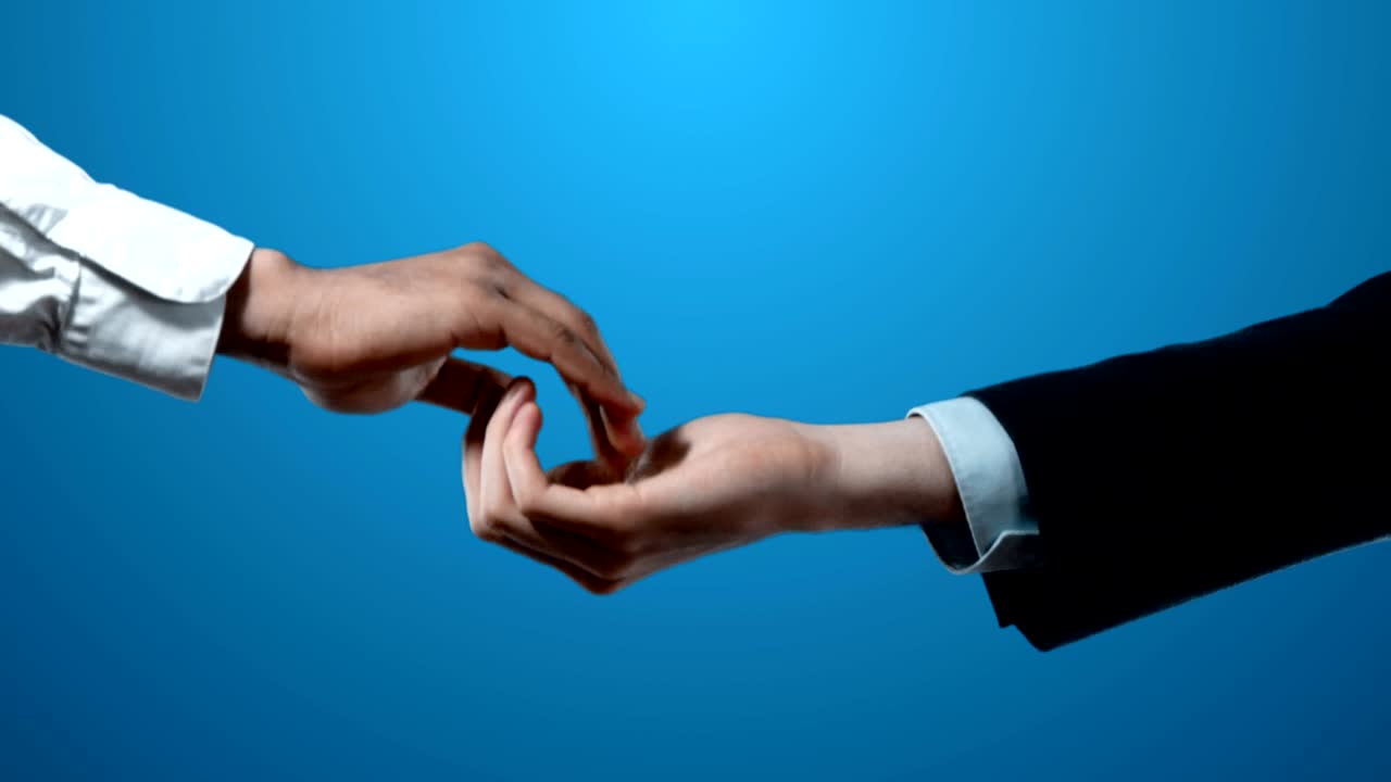 International Cooperation Handshake Between Two Business Men Suits Set as 4k Video Footage.