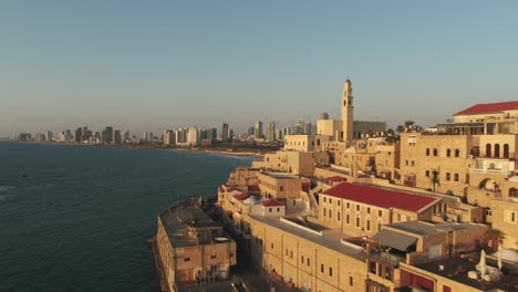 Aerial-view-of-Jaffa-old-city-port-and-marina-coastline-with-general-view-of-both-Jaffa-and-Tel-Aviv