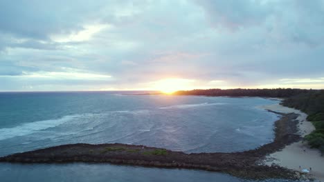 Cloudy sunrise over Turtle bay in Oahu, Hawaii, panoramic aerial view