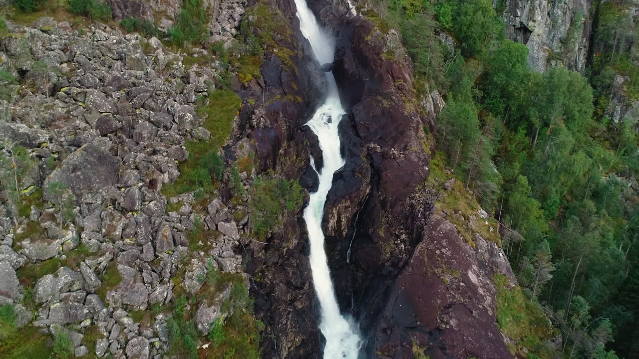 Aerial Crane Decreasing Altitude Following Låtefossen Waterfalls Downstream