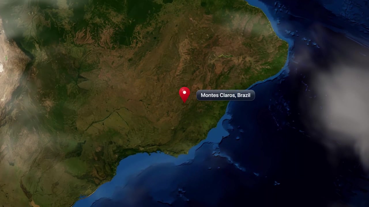 Satellite animation zooming from global space orbit directly to Montes Claros, Brazil with pin marker. Includes NASA public domain imagery.