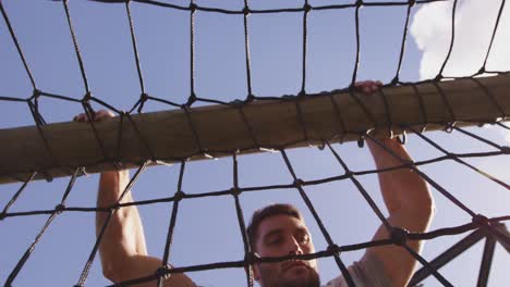 young man training at an outdoor gym bootcamp