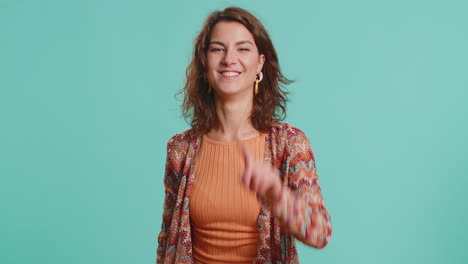 young caucasian woman pointing finger to camera making winner choice showing direction