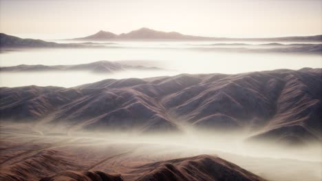 mountain landscape with deep fog at morning