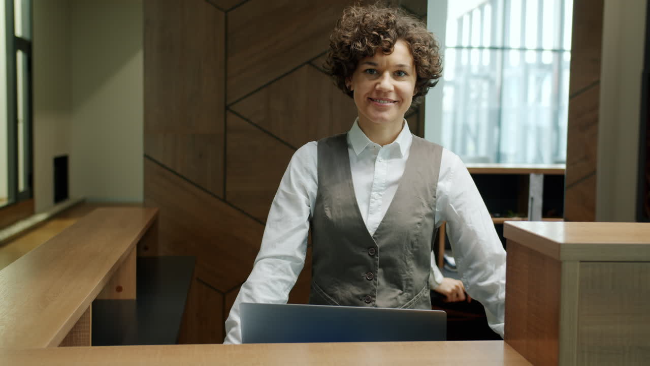 Smiling Receptionist at a Modern Office