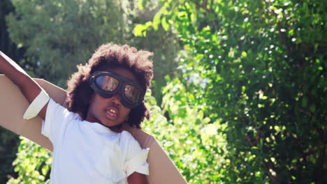 Little-boy-playing-with-a-toy-in-costume-of-aviator