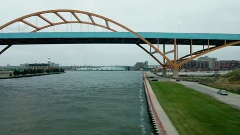 hoan bridge in downtown milwaukee on gloomy day, shot from river's perspective