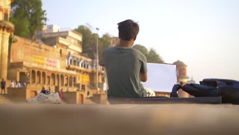 Man-Drawing-at-Sunset