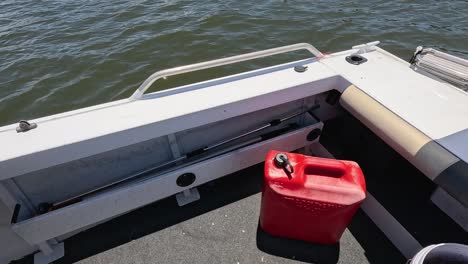 boat with red fuel tank on deck