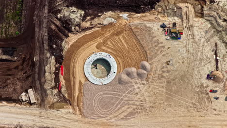 circular wind turbine foundation prepared with concrete forms and materials on construction site