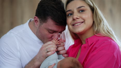 happy new parents with their newborn baby