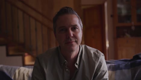 portrait of a man sitting at home