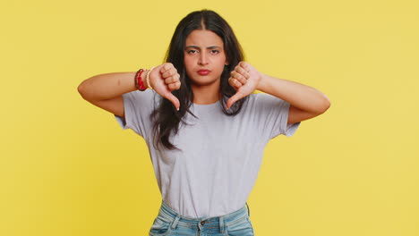 Upset-woman-girl-showing-thumbs-down-gesture-disapproval-dissatisfied-dislike-negative-feedback