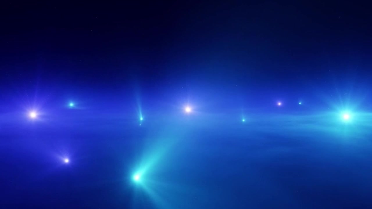 Abstrakte blaue Lichtpartikel, die im dunklen Raum schweben