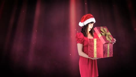 Excited-Santa-woman-opening-magical-Christmas-gift-box