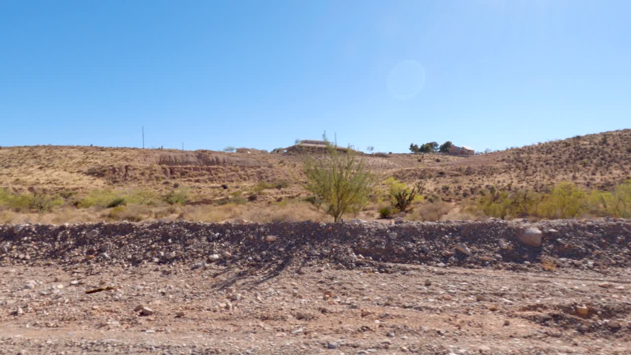 House In The Background Of The Desert