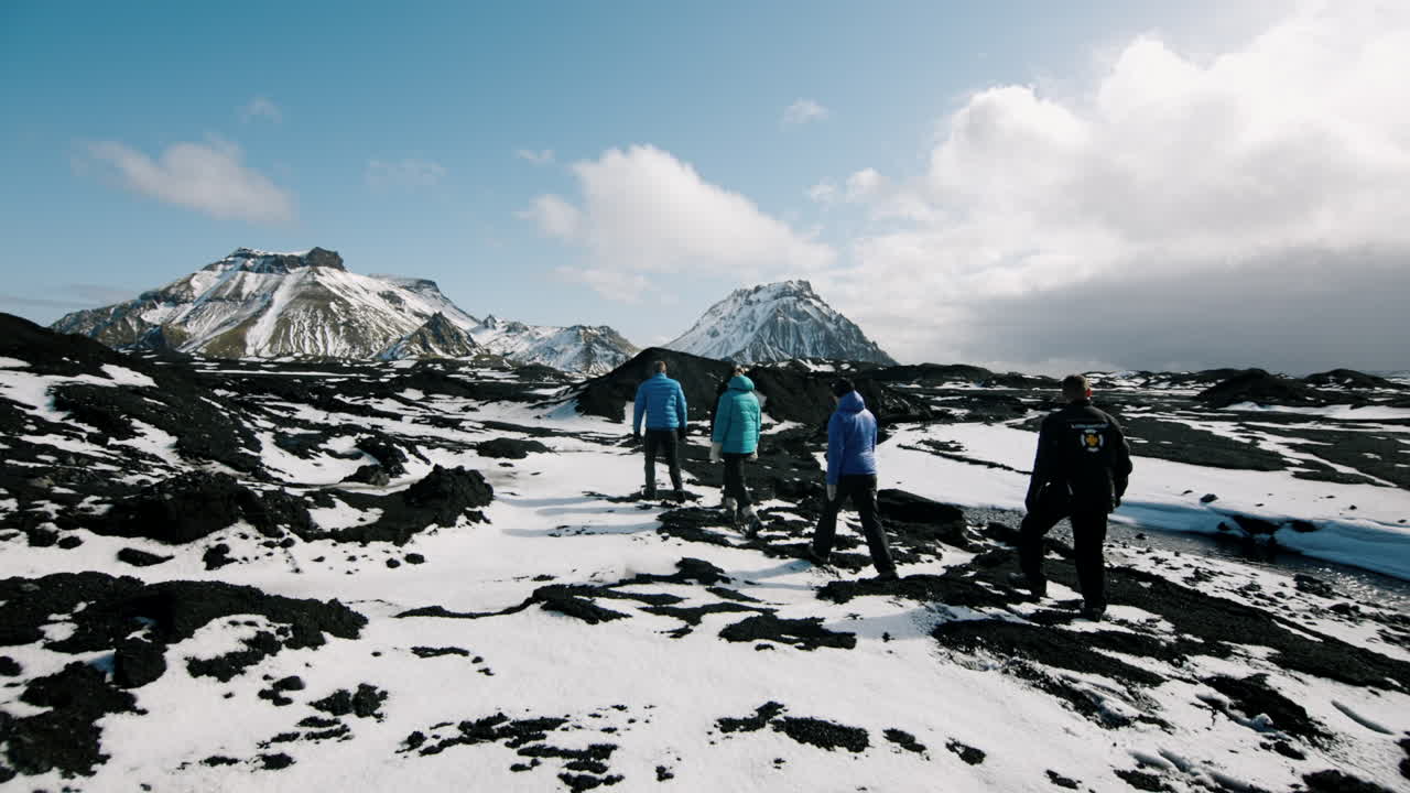 Hikers on a Volcanic Landscape in Iceland