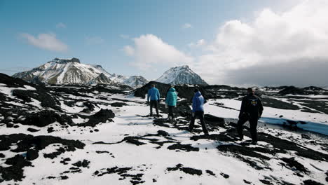 hikers on a volcanic landscape in iceland