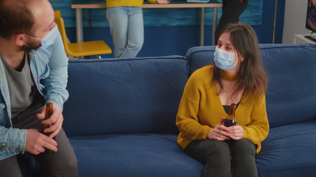 Cheerful friends touching elbow keeping social distancing greeting