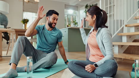 couple taking a break from exercising at home