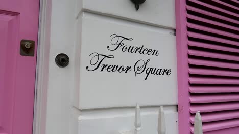 close-up of a white and pink house in fourteen trevor square, london, england