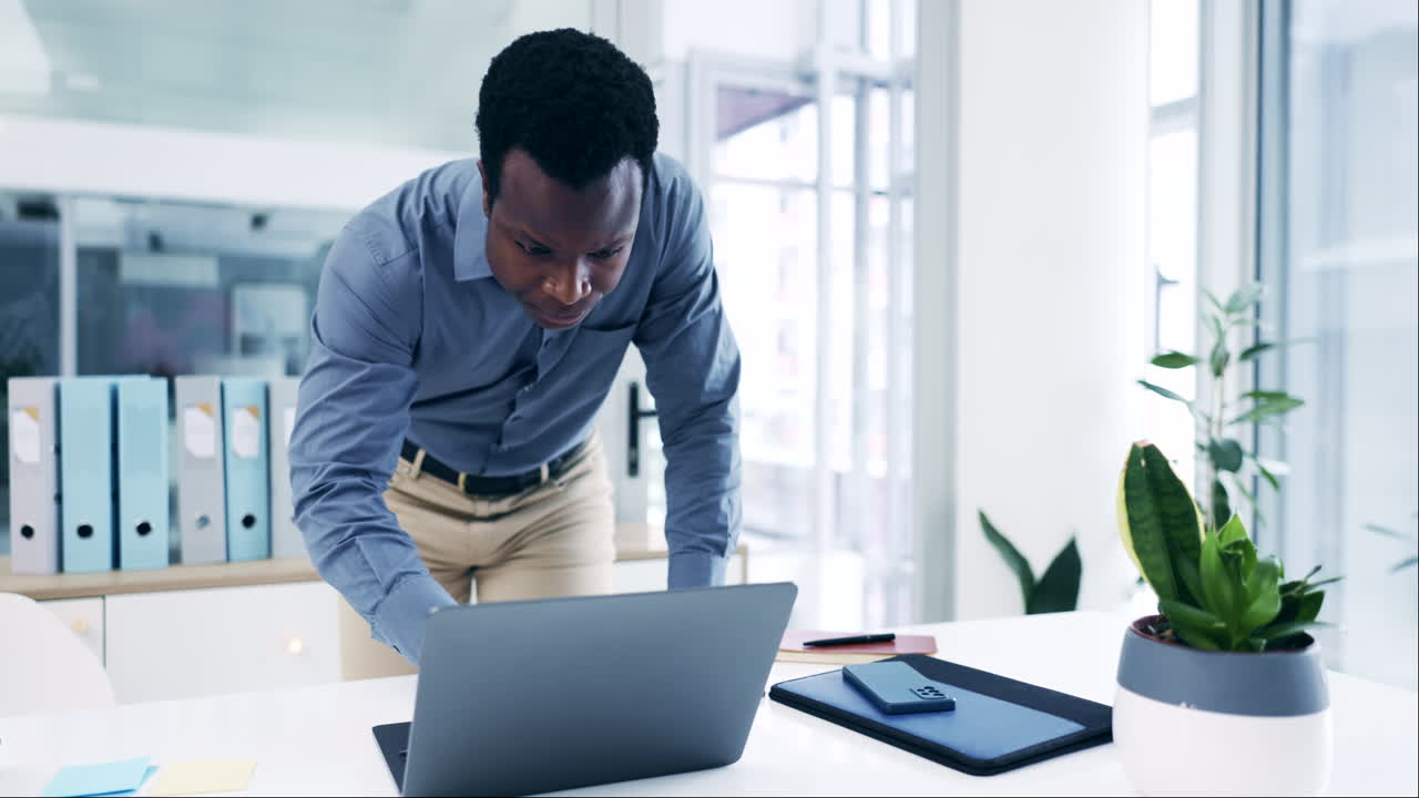 Busy, typing and a black man with a laptop at work