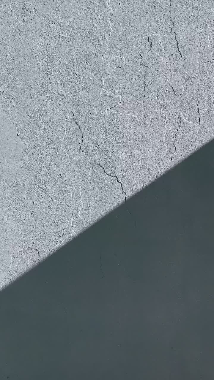 Shadow on a textured wall