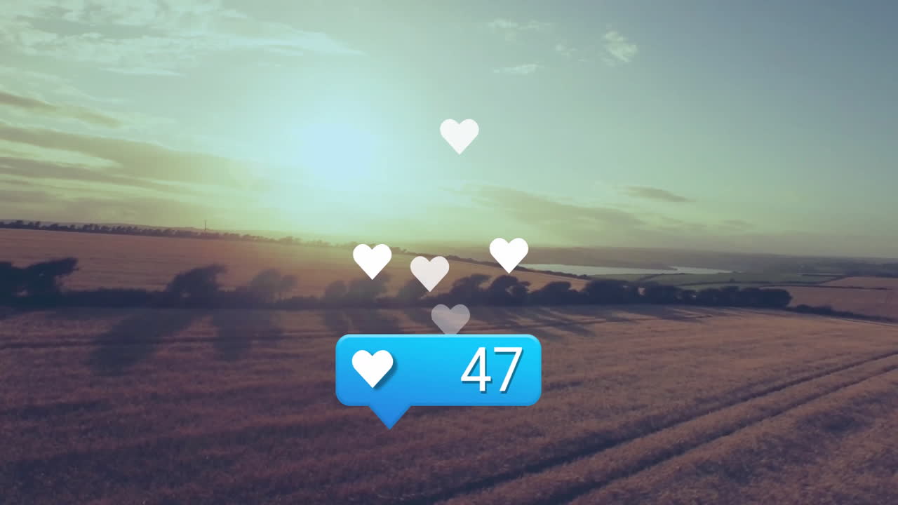 Blue notification bubble floating over golden field, displaying white heart icons and number