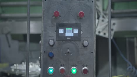 close-up of the controls of a metal milling machine in a factory setting