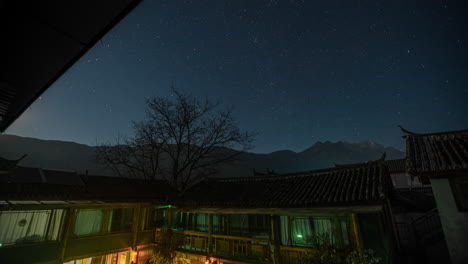 beautiful stars time lapse over traditional rural chinese village buildings