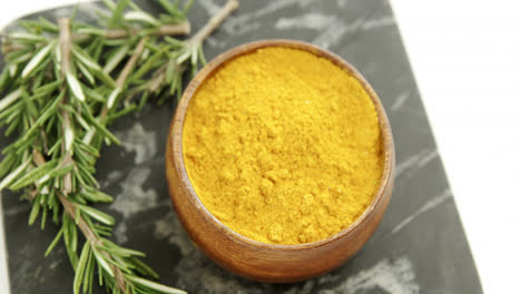 Rosemary-with-turmeric-powder-in-bowl-4k