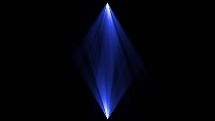 Blue spotlights and white laser holograms spins turns and emits light bright beams stage lights