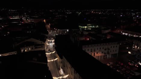 Malo-town-road-with-christmas-lights-at-night-in-the-province-of-Vicenza,-Italy