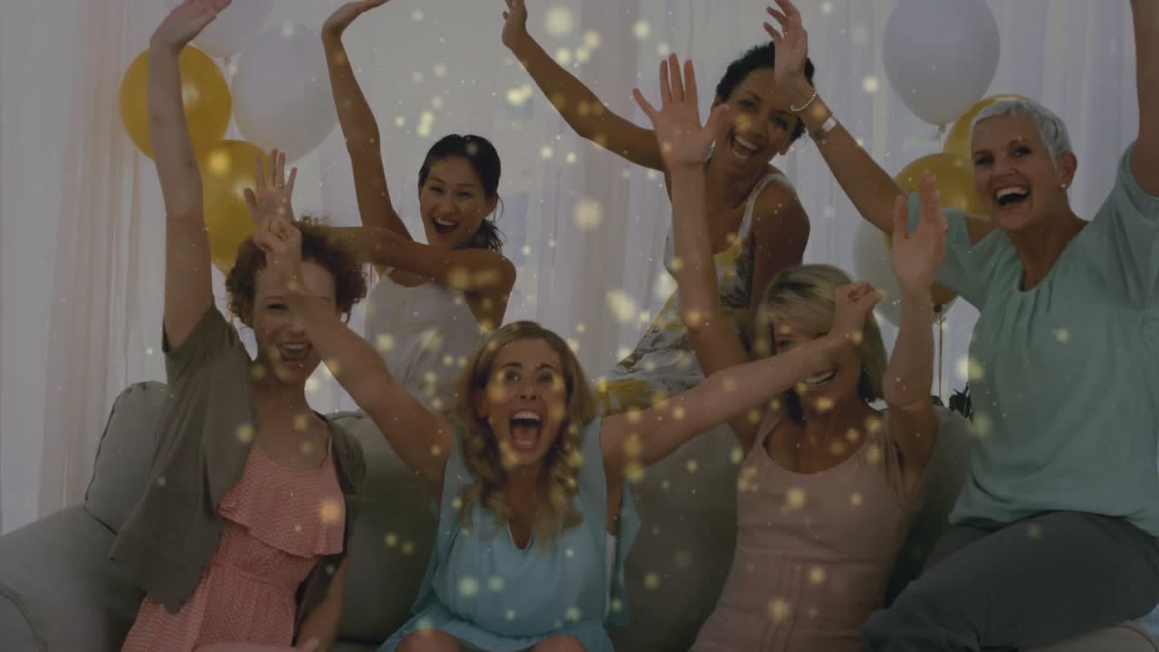Celebrating with confetti, joyful women in living room having fun together