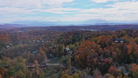 cabins nestled in fall colors in the smoky mountains, pigeon forge, tn